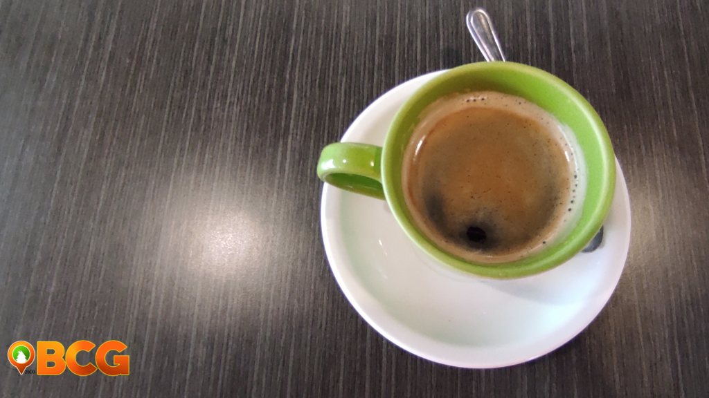 Steaming coffee cup on a table, suggesting late-night caffeine consumption.
